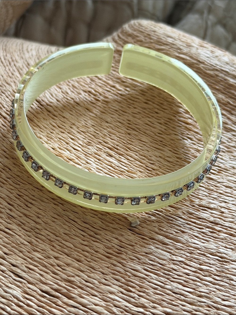 Pale yellow bangle with a strip of rhinestones very lightweight